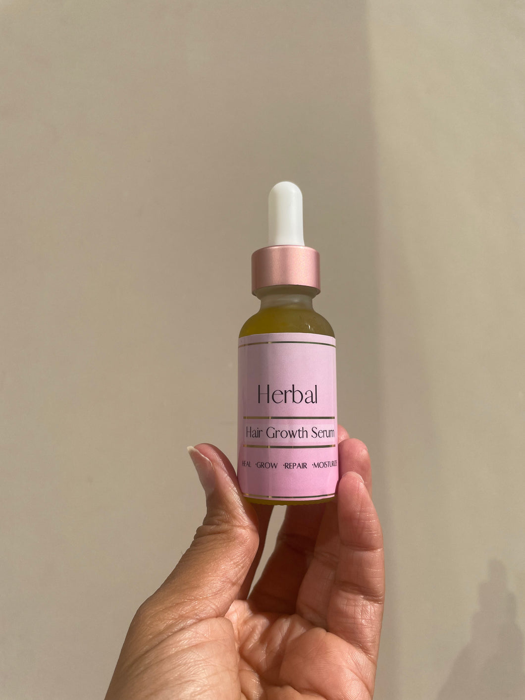 2 oz bottle of moisturizing herbal hair growth serum